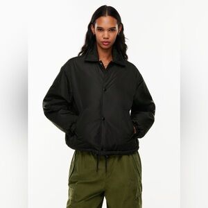 tna coaches puffer short